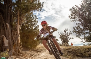 Great shot from the Haymaker classic of Cassie coming around a corner with the sun shining out from behind the clouds.